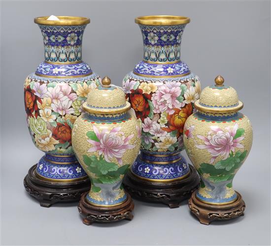A pair of Chinese cloisonne enamel vases and covers and a pair of similar vases, wood stands tallest 31.5cm excl. stands